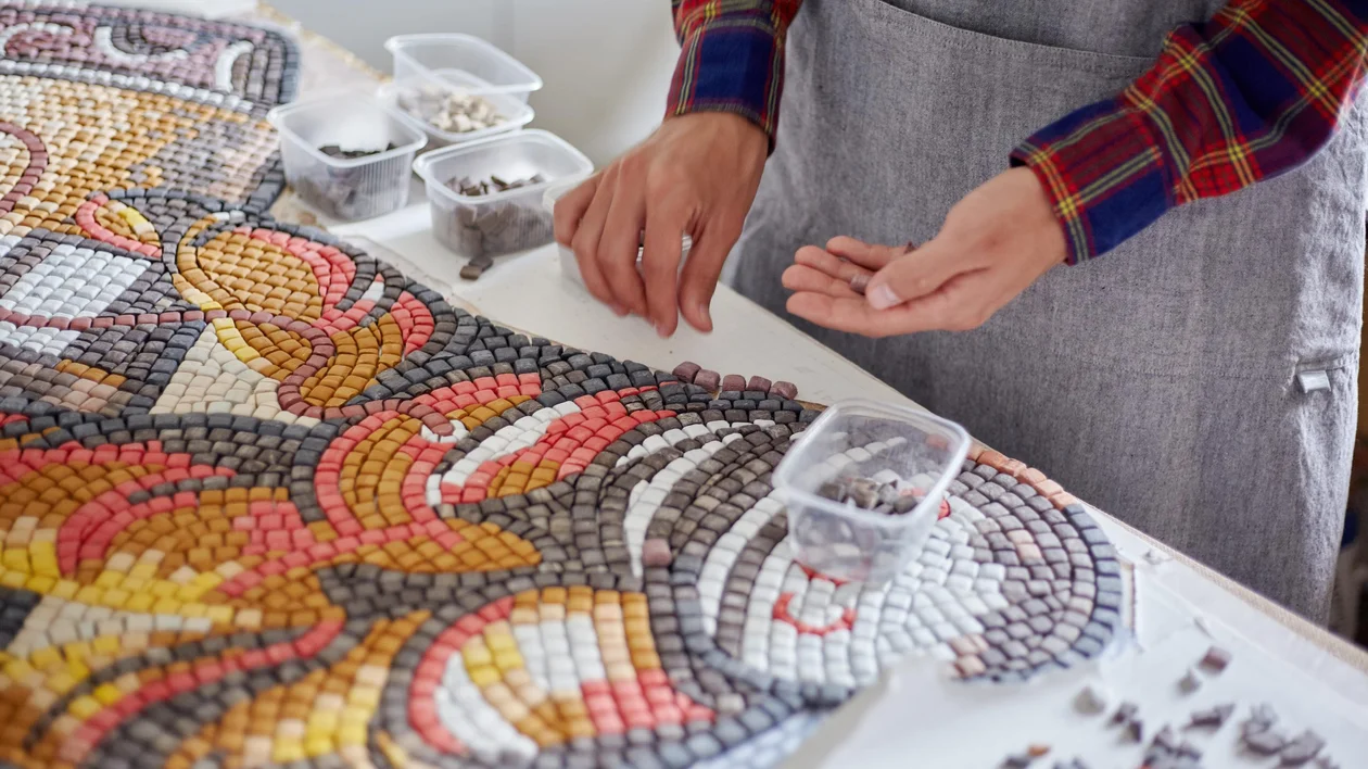 Assembling of small mosaic pieces to form the bigger picture.