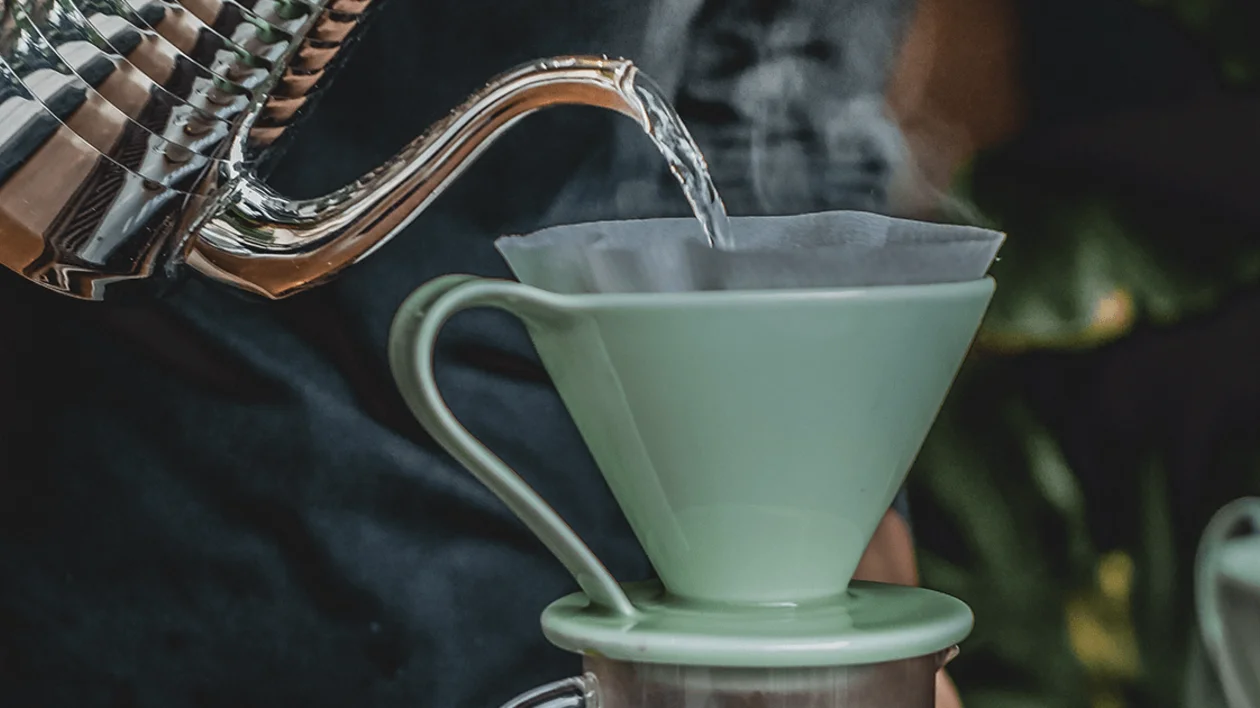 A barista making a pour-over-coffee.