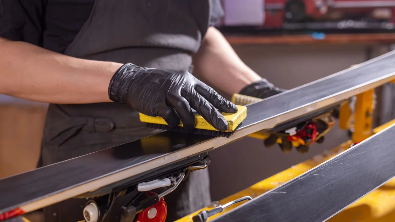 Shaping the final layer of the ski before decorating them.
