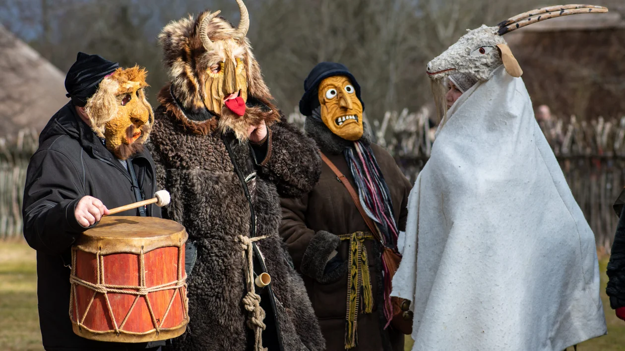 Men in traditional masks in Rumsiskes for Užgavėnės