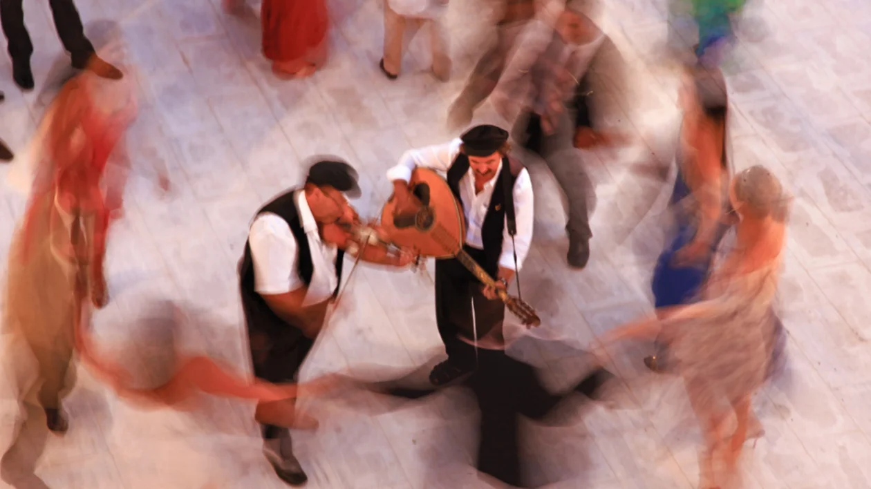 people are dancing in circle the traditional Greek dance