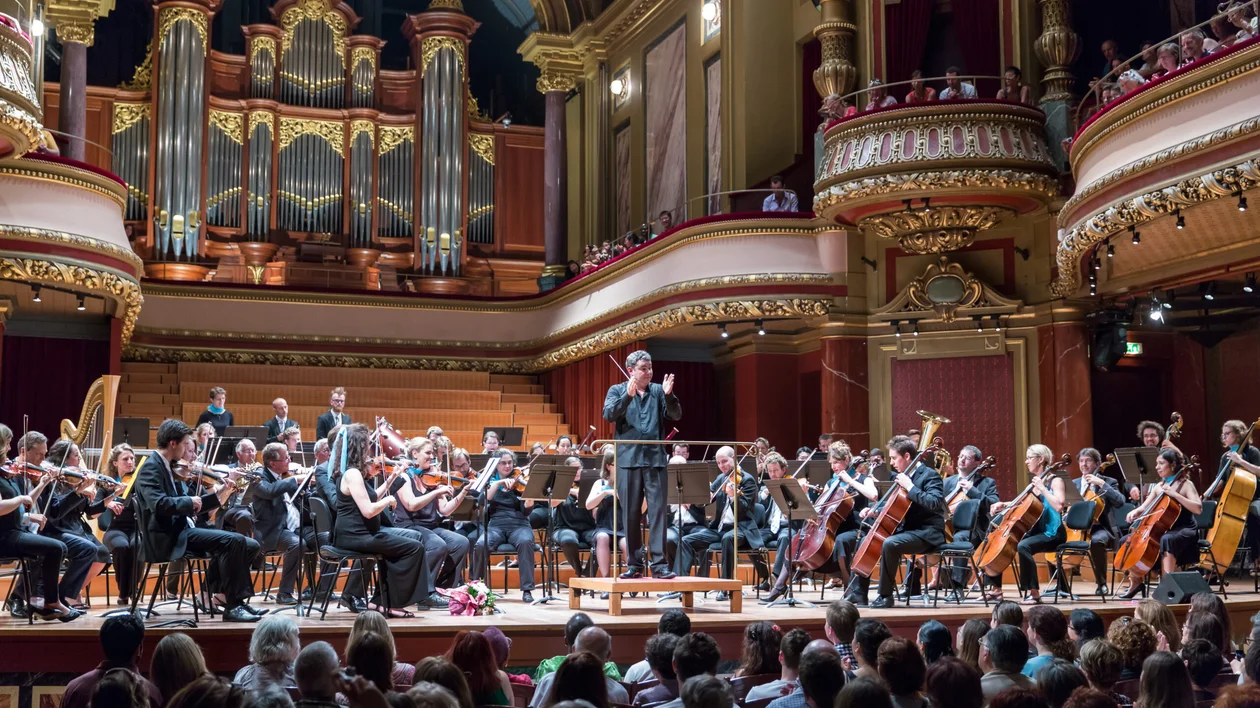 Orchestra is playing in a stunning theatre