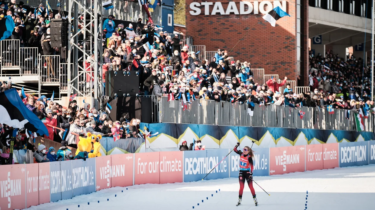 cheering to biathlon athletes in Estonian winter