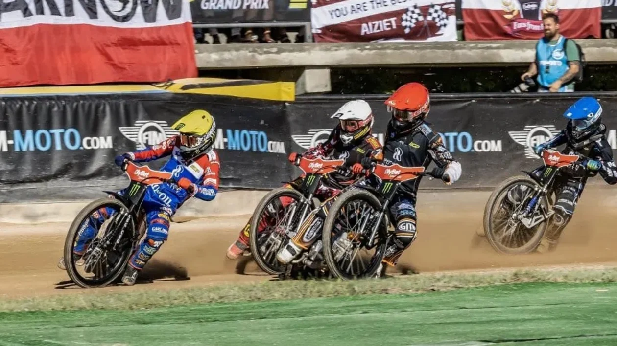 Guys on a motocycle for a sport competition, Latvia.