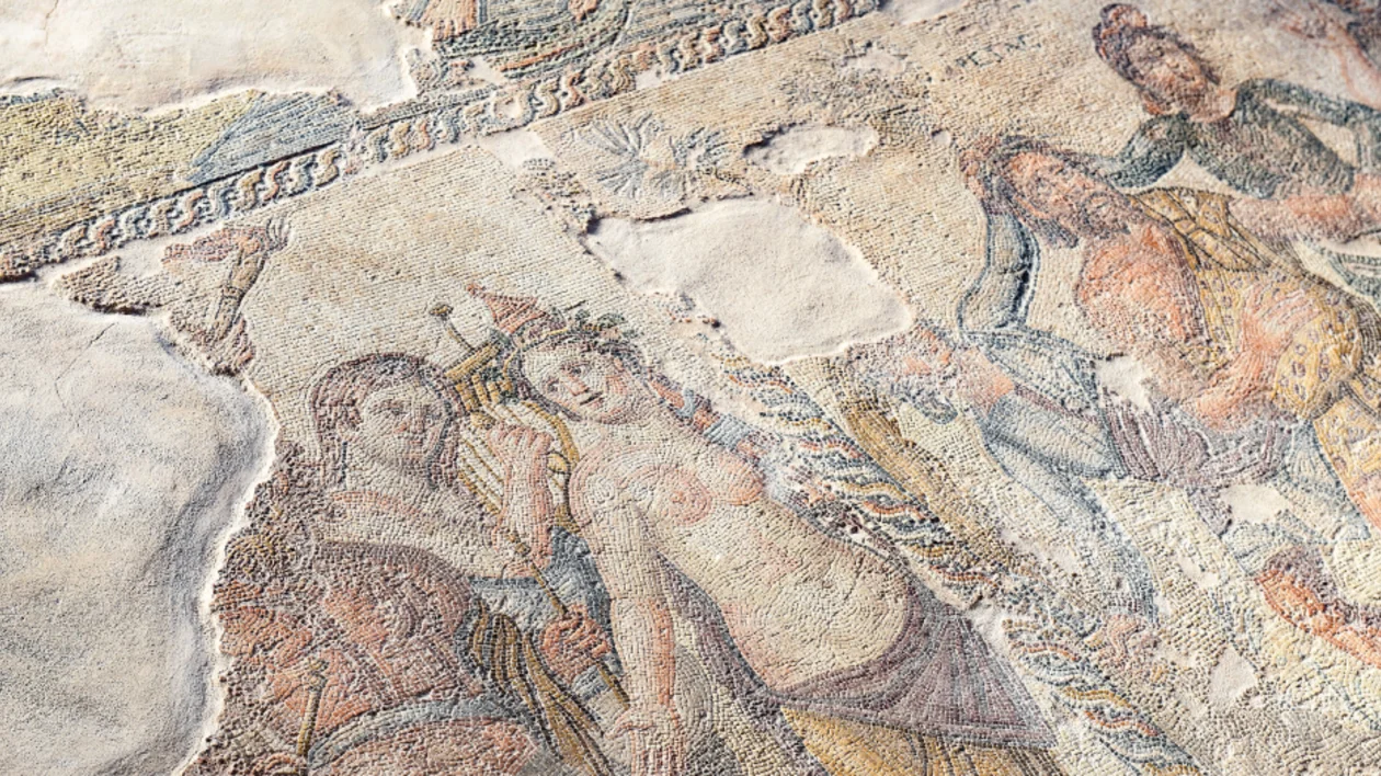 Ancient mosaic floor depicting human figures, from a historical site, Kato Pafos, in Cyprus.