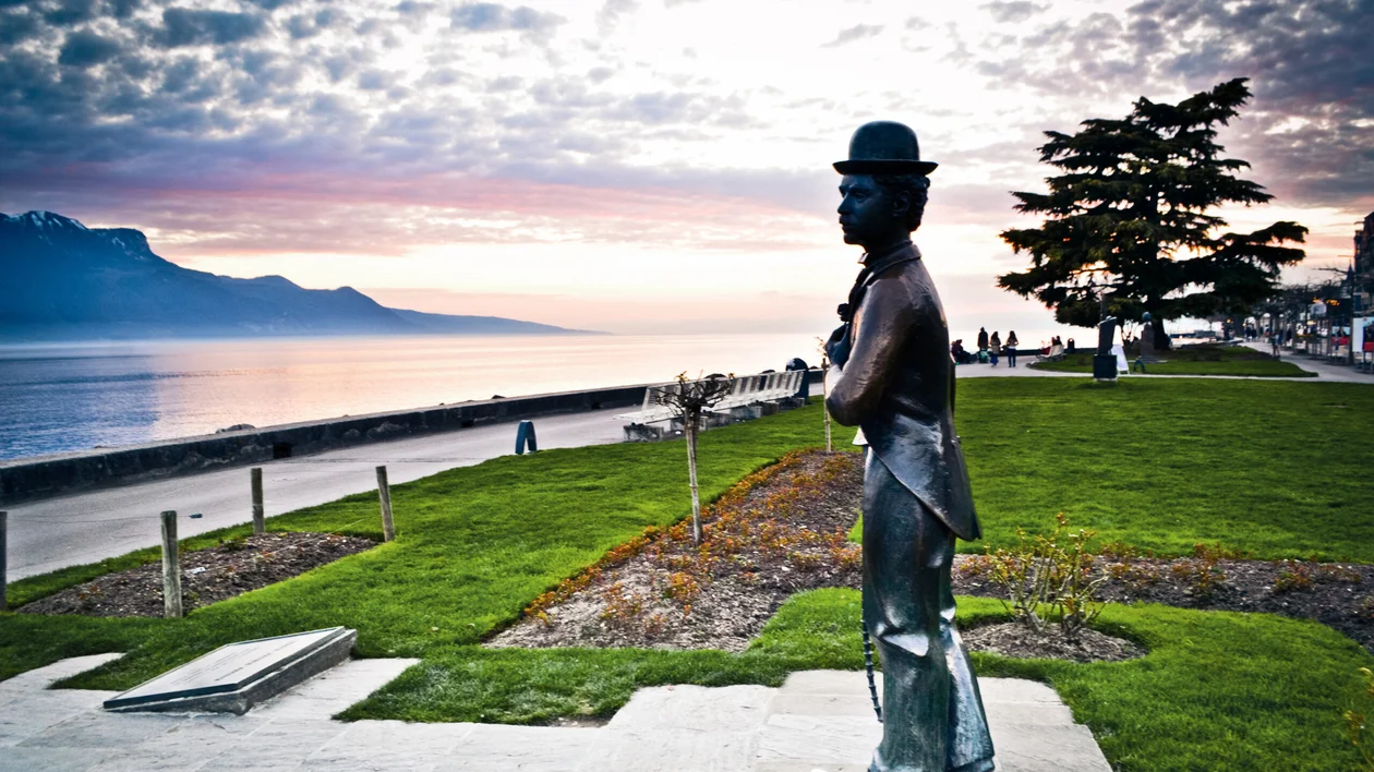 Statue of Charlie Chaplin overlooking Lake Geneva in Vevey