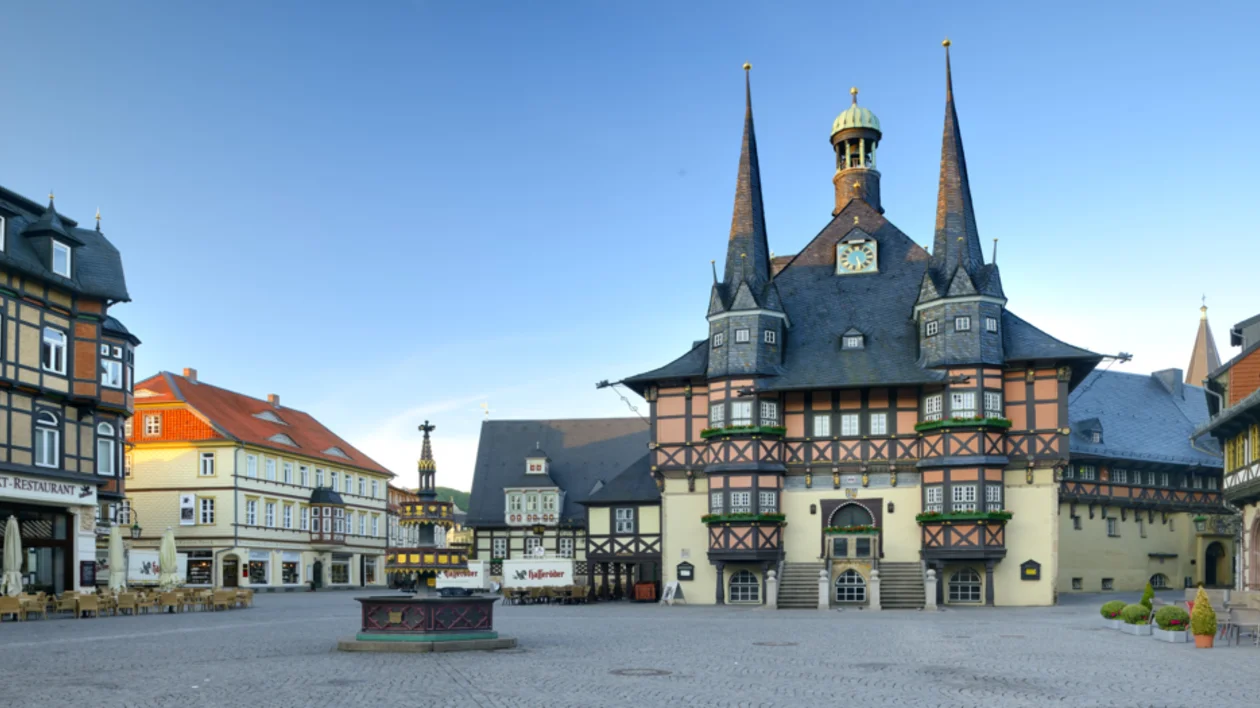 Historic half-timbered town hall on a cobblestone market square