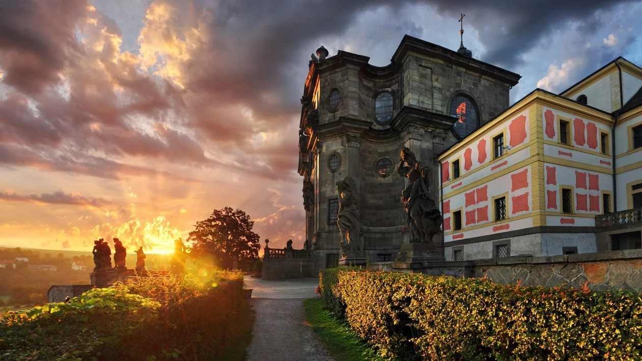 Baroque Hospital Kuks at sunset with statues and dramatic sky in the Czech Republic