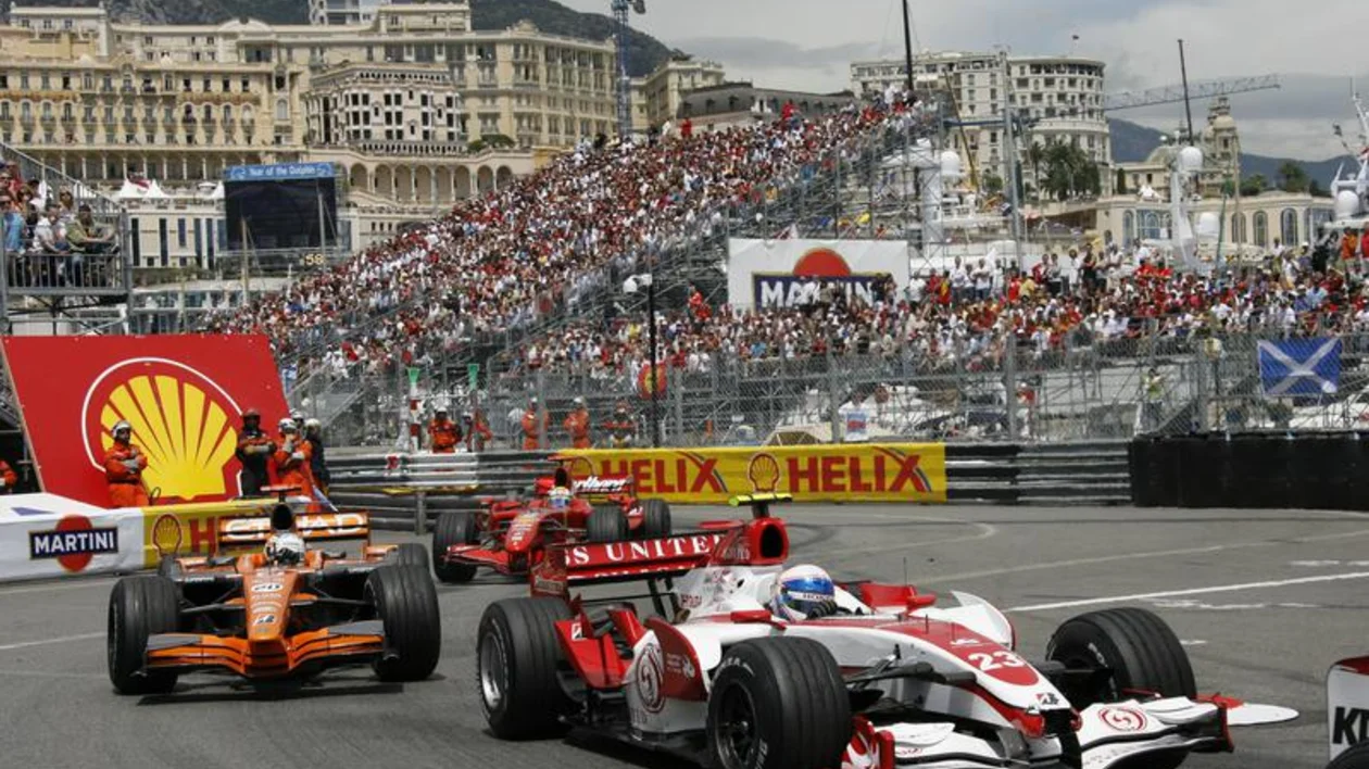 Formula 1 race cars hug the corners at the famous Monaco Grand Prix.