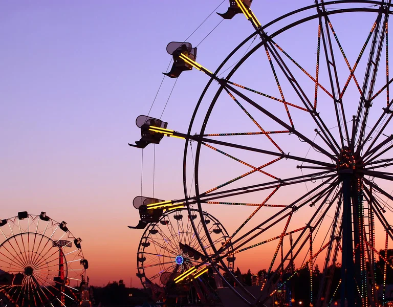 Ferris wheel in Tibidabo with panoramic view over Barcelona