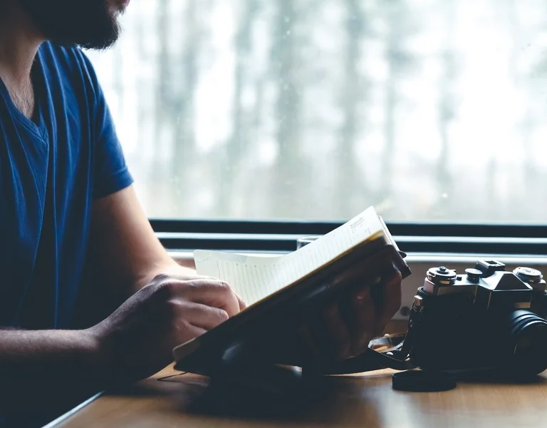 Man reading traveling