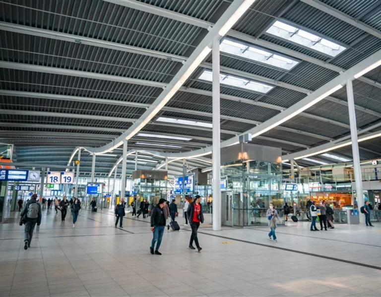 Utrecht Centraal Station seen from inside with people who travel Netherlands by train