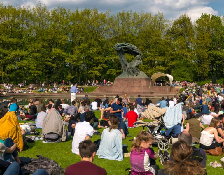 People sitted in a park during a sunny day