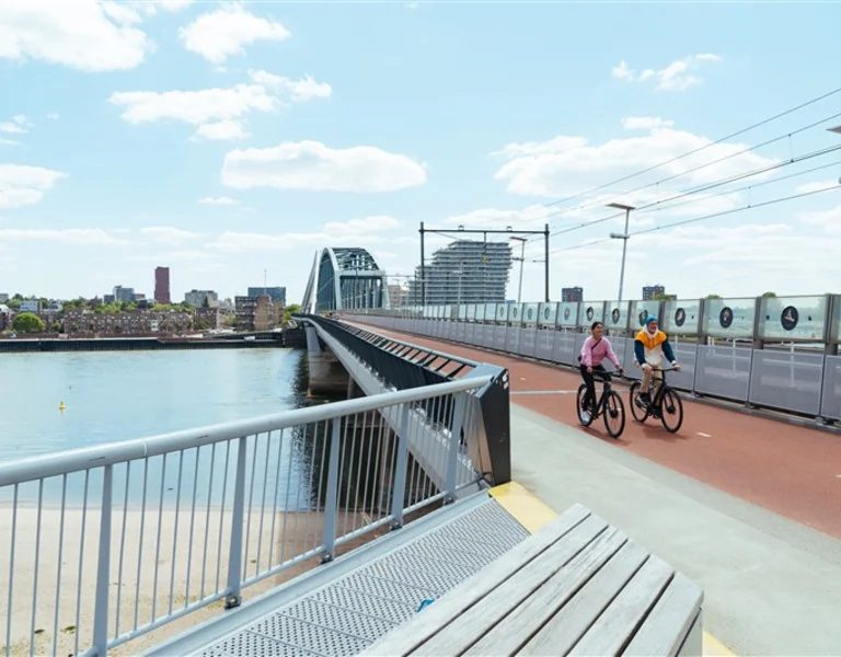 People cycling on a bridge in the Netherlands