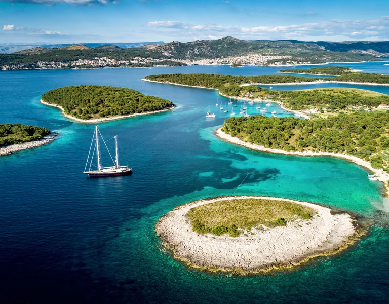 Aerial view of Paklinski Islands in Hvar, Croatia. Turquise water bays with luxury yachts and sailing boats.