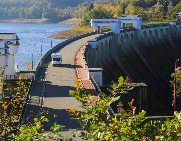 Landscape in Wallonia, Belgium with a road through the rive and green scenery.