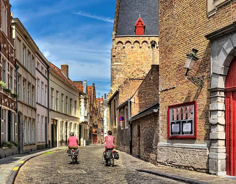 Cyclists in the historic centre of Bruges, Belgium