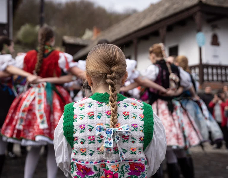 A litte kid at Hollókő a folklore and cultural celebration in Hungary.