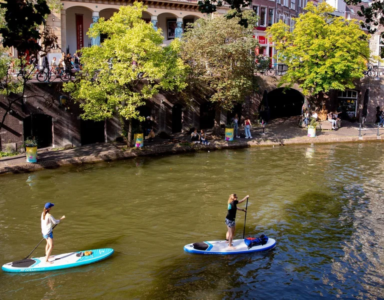 Two girls paddling in Utrech Netherlands.