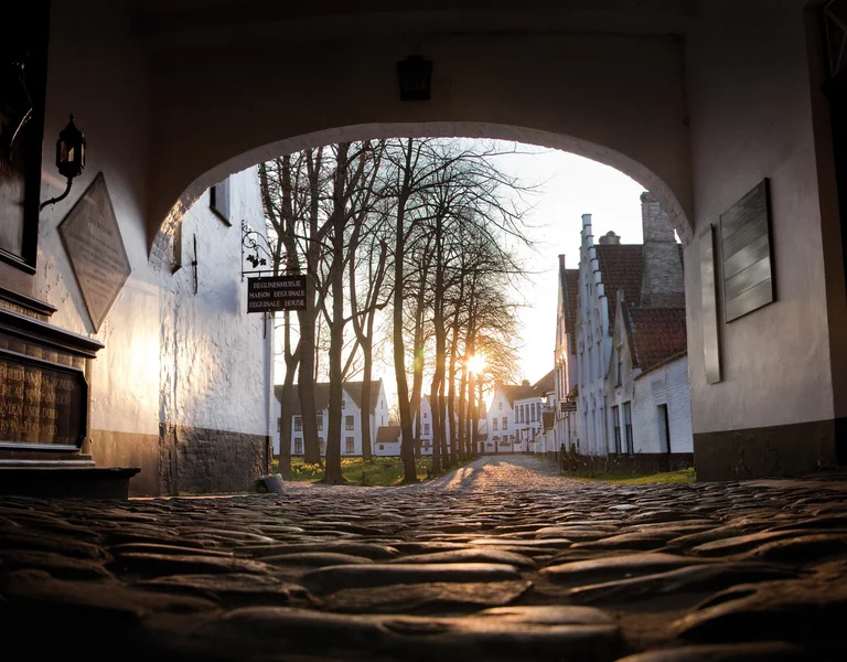 Cobblestone street and historic houses in Bruges, Belgium