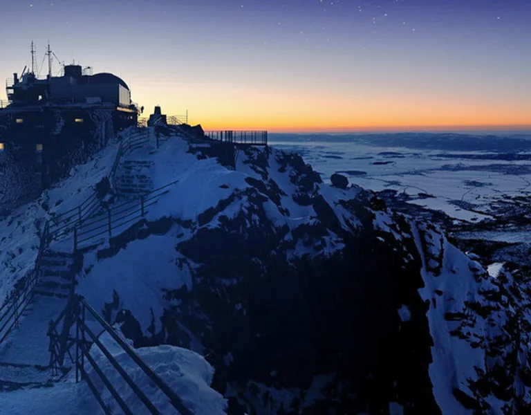 Snowy mountain peak at dawn