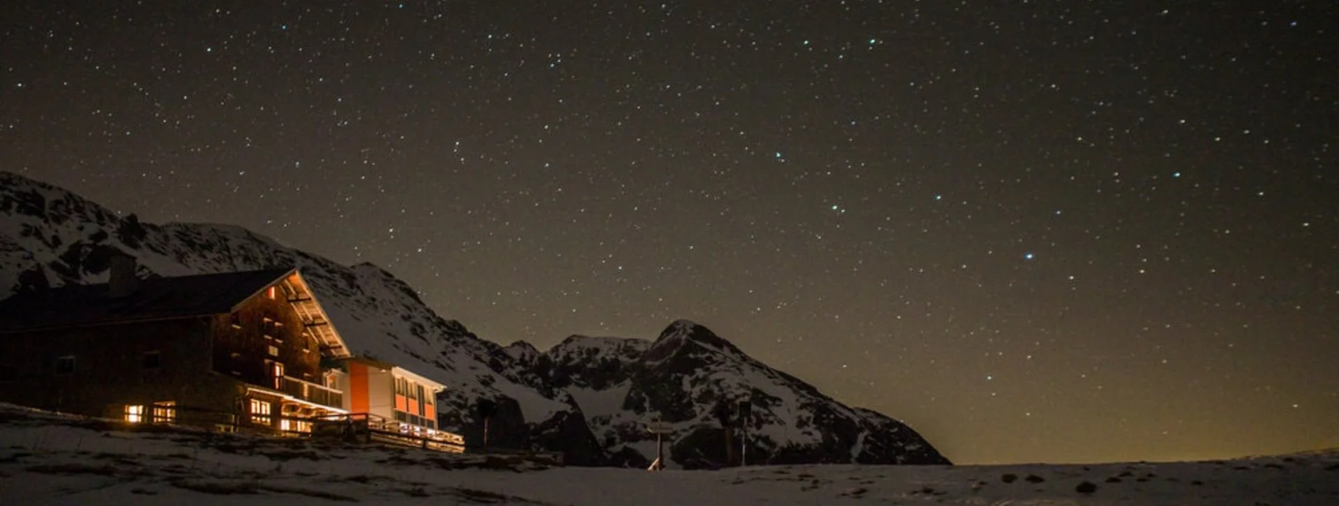 A Berchtesgaden mountain shelter under a starry sky