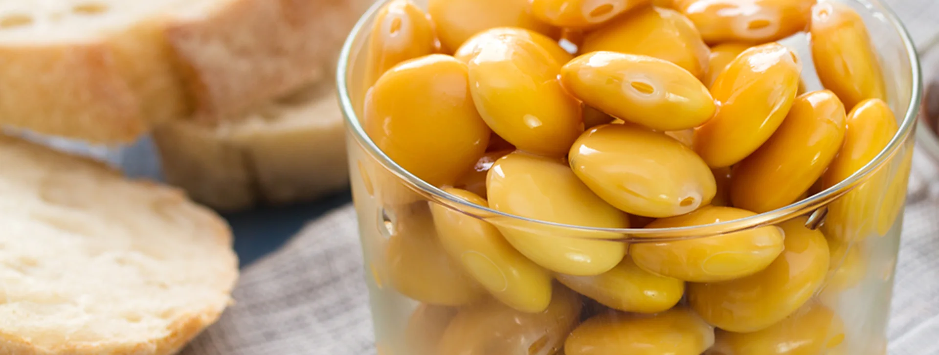 Taste vibrant yellow lupin beans, often served as a snack in Portugal.