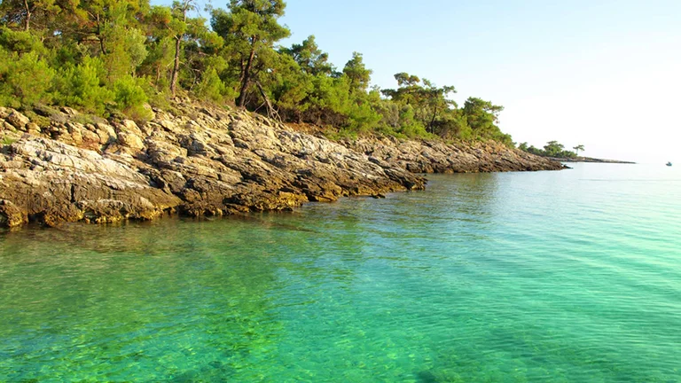 Cliffs with green sea, Marmaris, Turkey