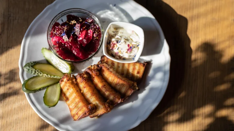 For comfort, order Babka Ziemniaczana, a potato pie that's crispy outside, soft inside, and tastes great with a counterpoint of pickled vegetables.