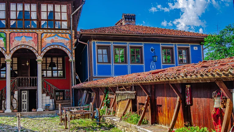 Colourful 19th-century Bulgarian houses with painted façades and tiled roofs in the museum town of Koprivshtitsa.
