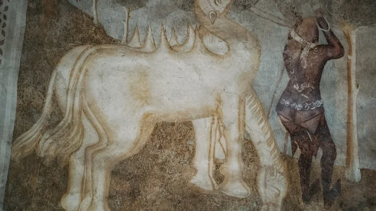 Medieval wall painting of a horse inside the Gothic church of Kraskovo, Slovakia, showcasing historic fresco art on the church walls.