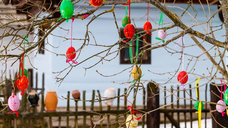 Easter eggs holding on a trees at the open-air museum.
