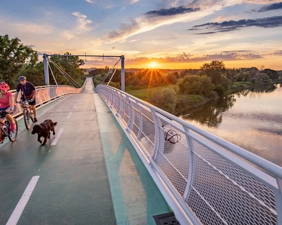 Follow EuroVelo route 13 for a history lesson from the Iron Curtain era. Along the way, cross the Freedom Cycling Bridge.