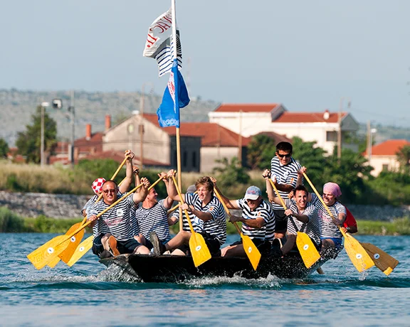 Tourists flock to southern Croatia to see neretva boats in the exciting Ladja Marathon boat race.