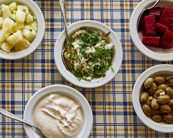 Sample your way through a selection of Cypriot dips including tzatziki, taramasalata, olives, and potato salad.