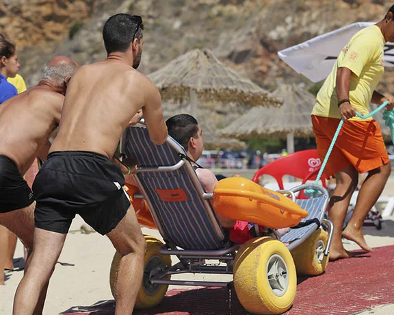 Sand and sun at the beach are for everyone, using special sand wheelchairs.
